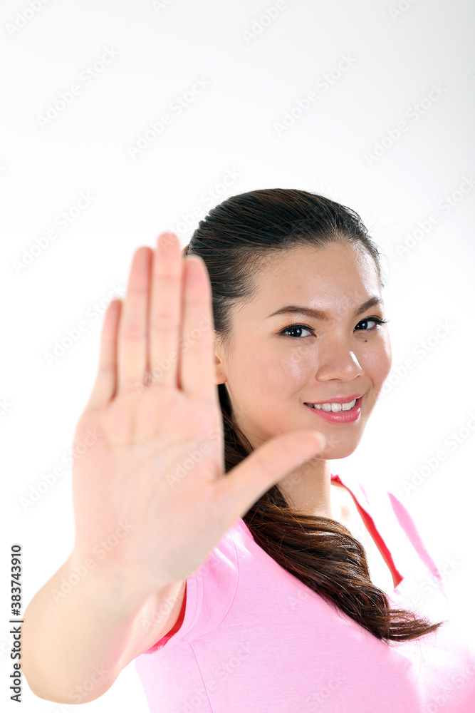 beautiful young south east Asian Chinese woman hand stop sign on white background beautiful young south east Asian Chinese woman hand stop sign on white background