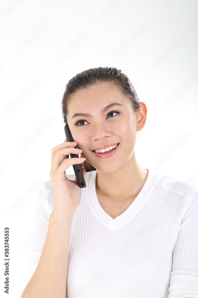 beautiful young south east Asian Chinese talk on phone happy on white background beautiful young south east Asian Chinese talk on phone happy on white background