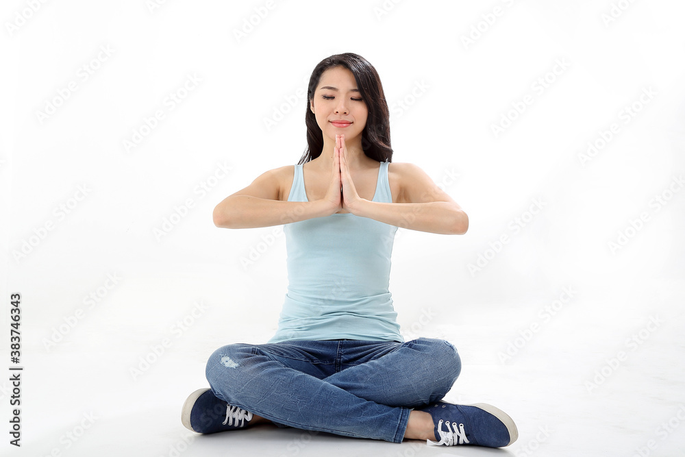 Beautiful young south east Asian Chinese woman yoga workout exercise on white background Beautiful young south east Asian Chinese woman yoga workout exercise on white background