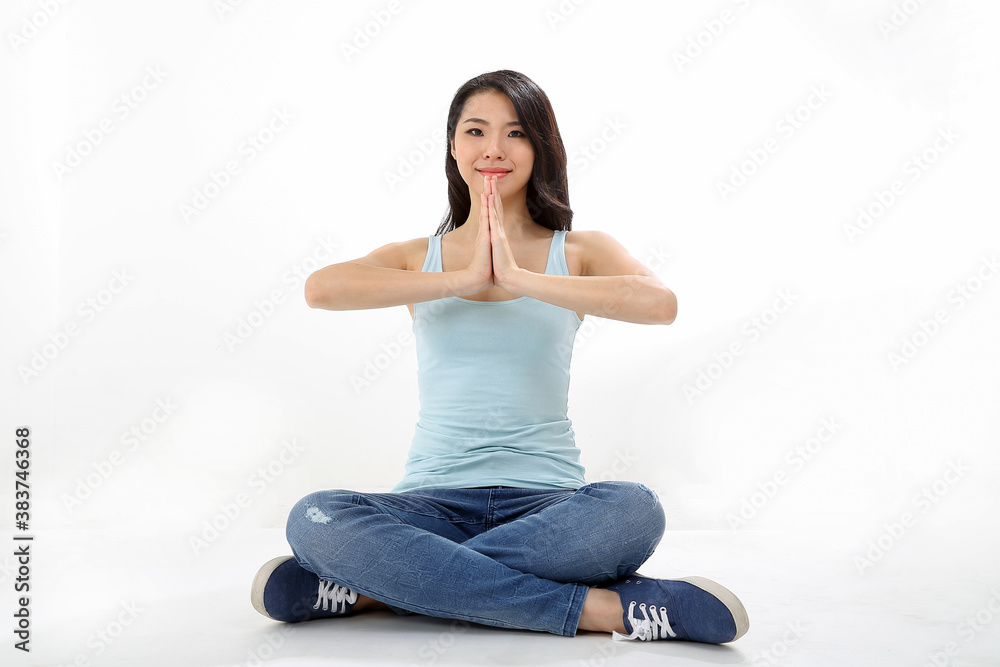 Beautiful young south east Asian Chinese woman yoga workout exercise on white background Beautiful young south east Asian Chinese woman yoga workout exercise on white background