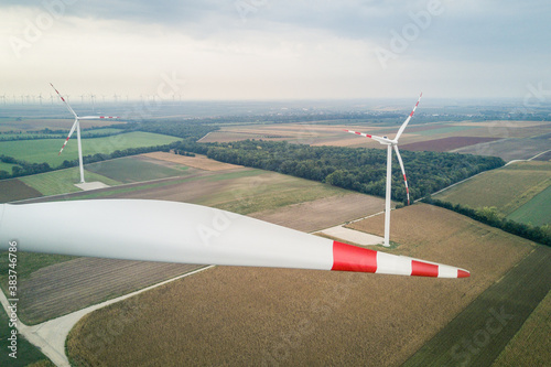 Wind turbine blade with two wind turbines in the fields in the background