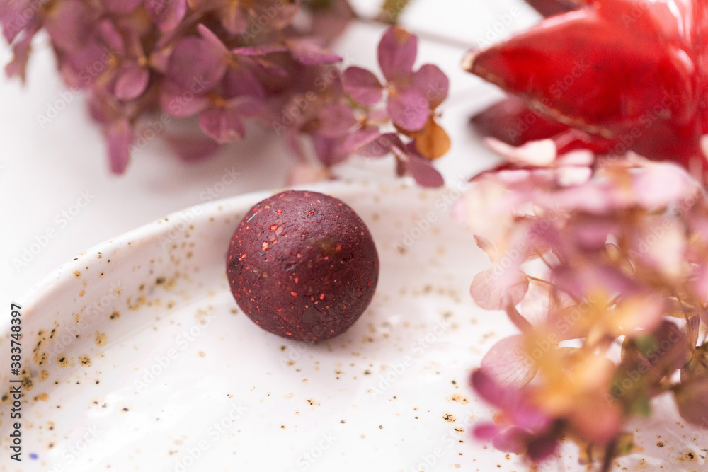 Candy of dried berries on a plate with a beautiful design Candy of dried berries on a plate with a beautiful design