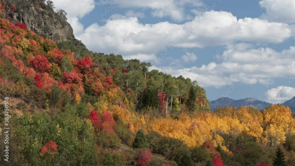 Clouds moving in time lapse over colorful Fall mountainside in Idaho. Clouds moving in time lapse over colorful Fall mountainside in Idaho.