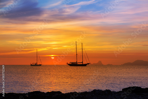 colorful sunset of Ibiza view from formentera