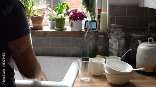 Washing hands in kitchen and keepaway from corona virus and decease.