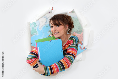 Student in front of a map photo