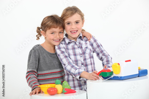 portrait of two children playing photo