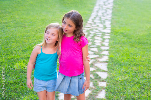 friends sister girls together in grass garden track photo