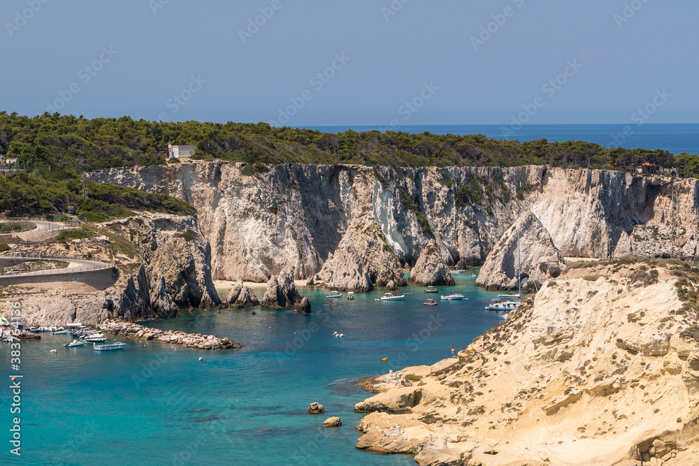 The rock and cobalt blue sea of San Domino Island on the archipelago of the tremiti islands in Puglia, Gargano, Italy