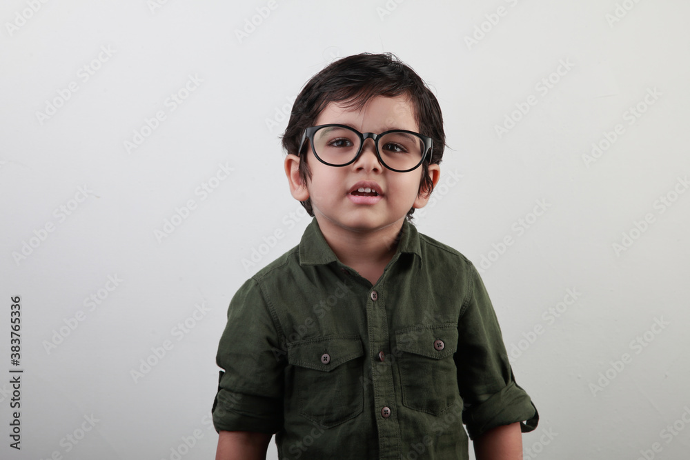 Happy little boy looking through a big eye wear Happy little boy looking through a big eye wear
