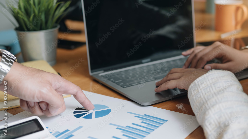 Two businessmen discussion analysis sharing calculations about the company budget and financial planning together on desk at the office room. Two businessmen discussion analysis sharing calculations about the company budget and financial planning together on desk at the office room.