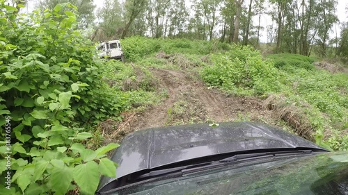 off-road camera-car su sterrato, campi e fango - seguiamo un LandRover Defender - a bordo di un Freelander 2 - zona Lomellina - Italia photo