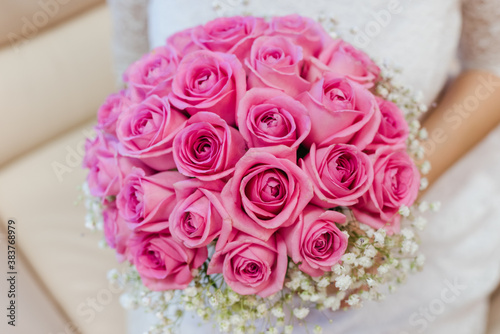 bride holding bouquet  bouquet of pink roses  wedding day  the bride s bouquet