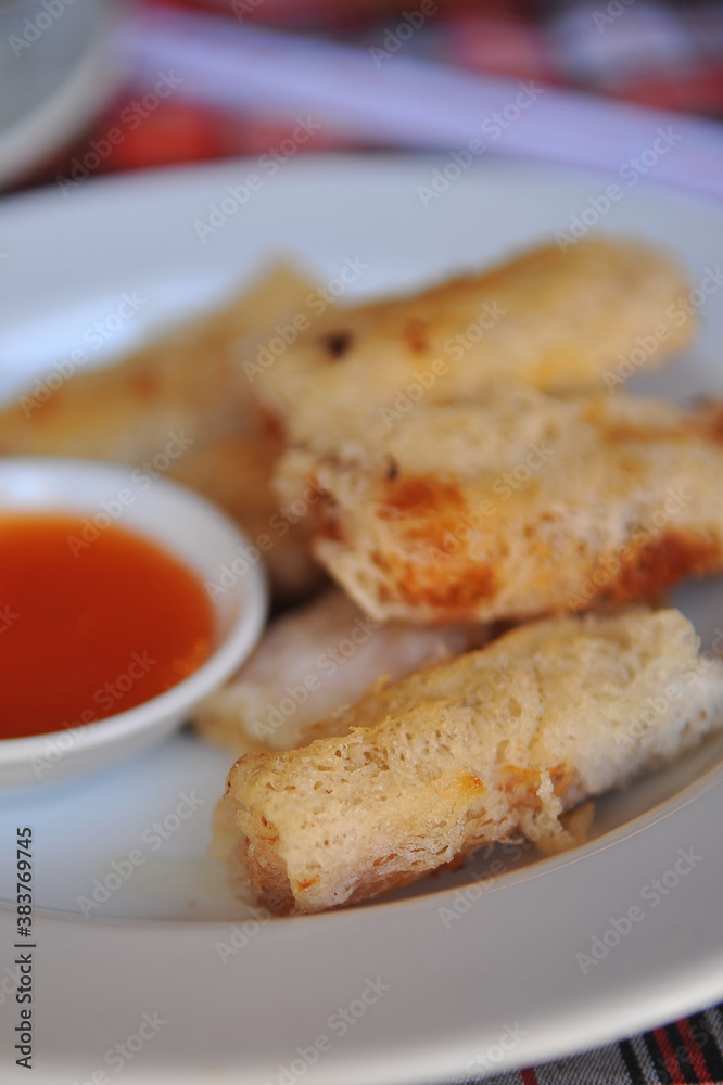 (Cha Gio Re) Vietnamese net spring rolls with dipping sauce. (Cha Gio Re) Vietnamese net spring rolls with dipping sauce.