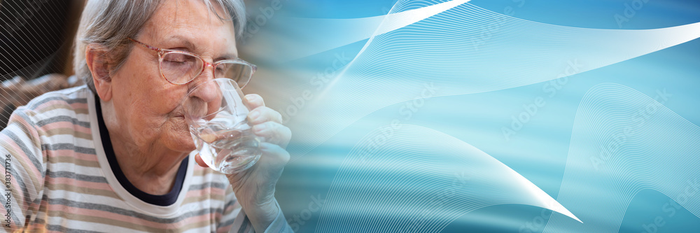 Elderly woman drinking water; panoramic banner Elderly woman drinking water; panoramic banner