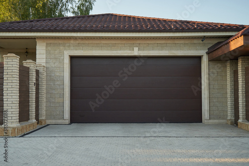 Modern wide gates for two cars in a private house