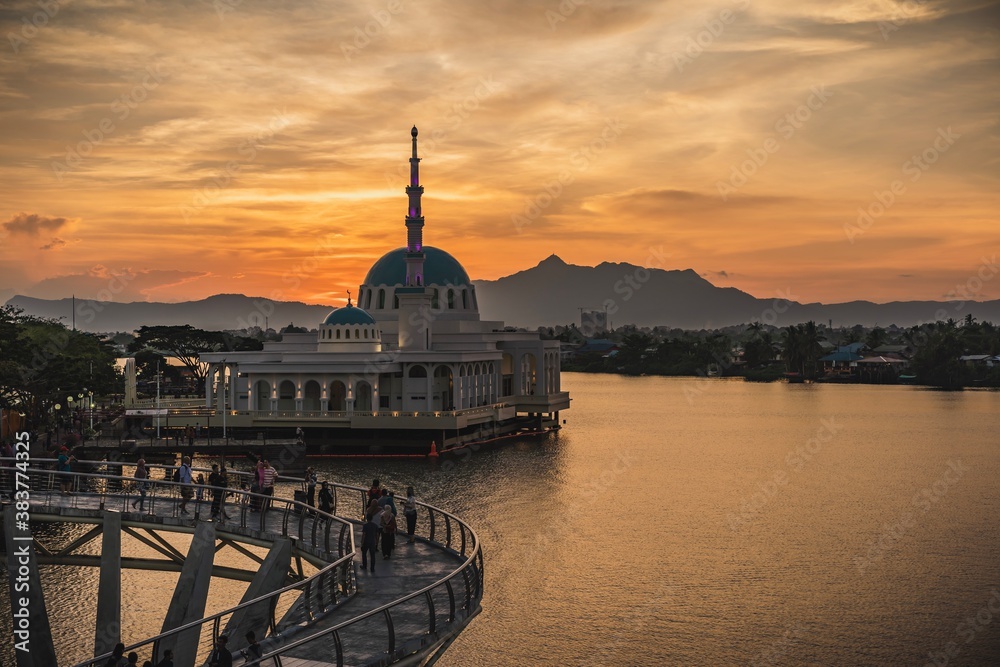 The floating mosque of Kuching and The Darul Hana Bridge during sunset The floating mosque of Kuching and The Darul Hana Bridge during sunset