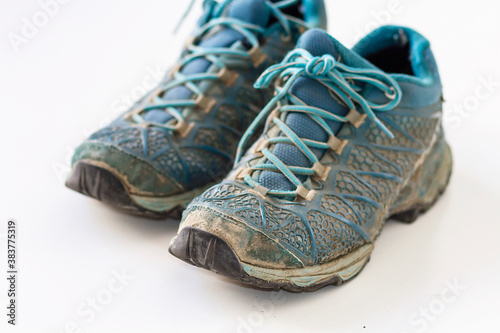 A pair of mountain shoes very used and dirty