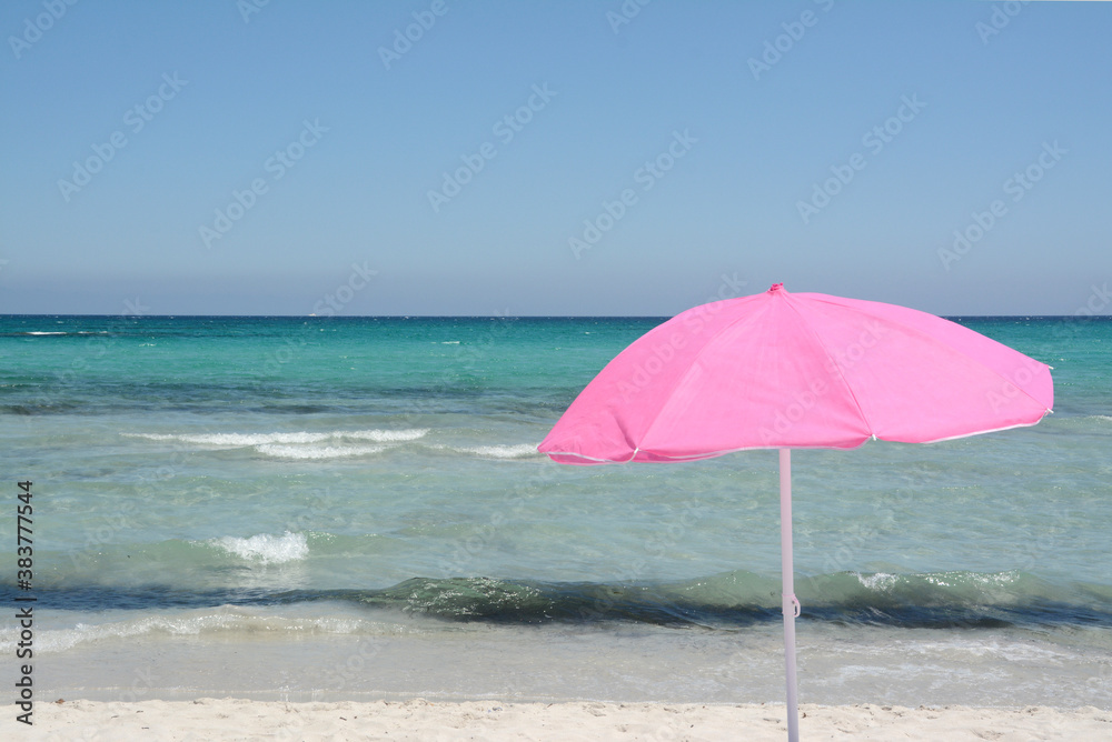 Italy / Sardinia – July 13, 2020: A holiday in Italy is beautiful living the days on the beach away from the sun with colorful umbrellas.