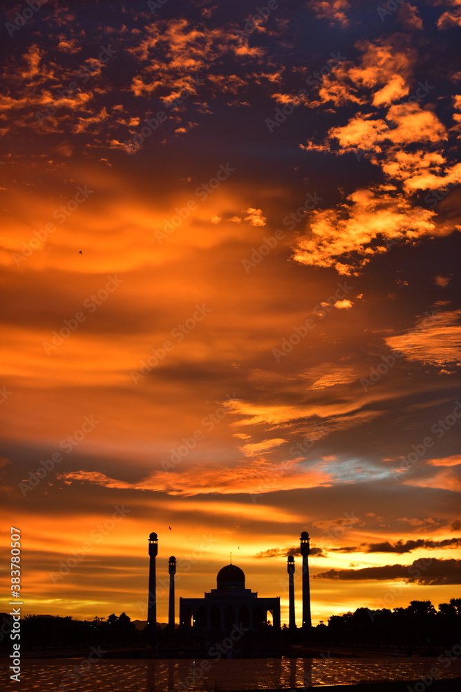 Sunset view with beautiful golden sky At Masjid in the middle of Songkhla Province, the colorful sky lights in the evening Sunset view with beautiful golden sky At Masjid in the middle of Songkhla Province, the colorful sky lights in the evening