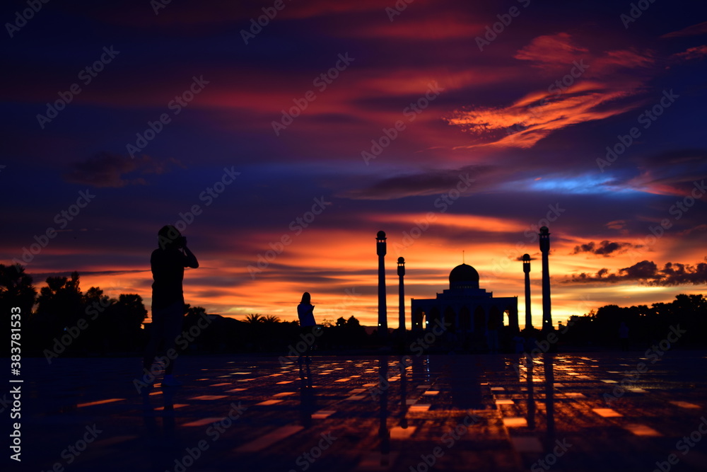 Sunset view with beautiful golden sky At Masjid in the middle of Songkhla Province, the colorful sky lights in the evening Sunset view with beautiful golden sky At Masjid in the middle of Songkhla Province, the colorful sky lights in the evening