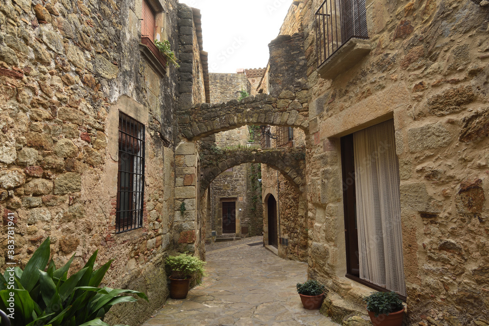 streets and arch of the old town of medieval village of Pals, Girona province, Catalonia, Spain