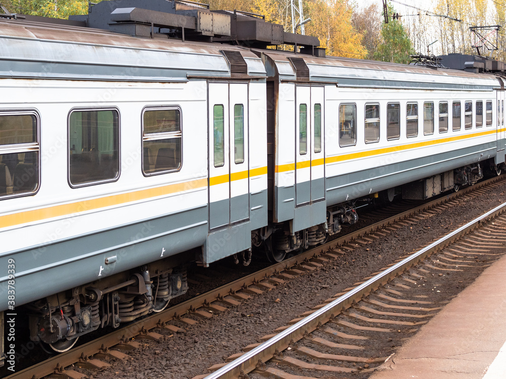 Fototapeta premium train cars on railway platform in Moscow region on autumn evening