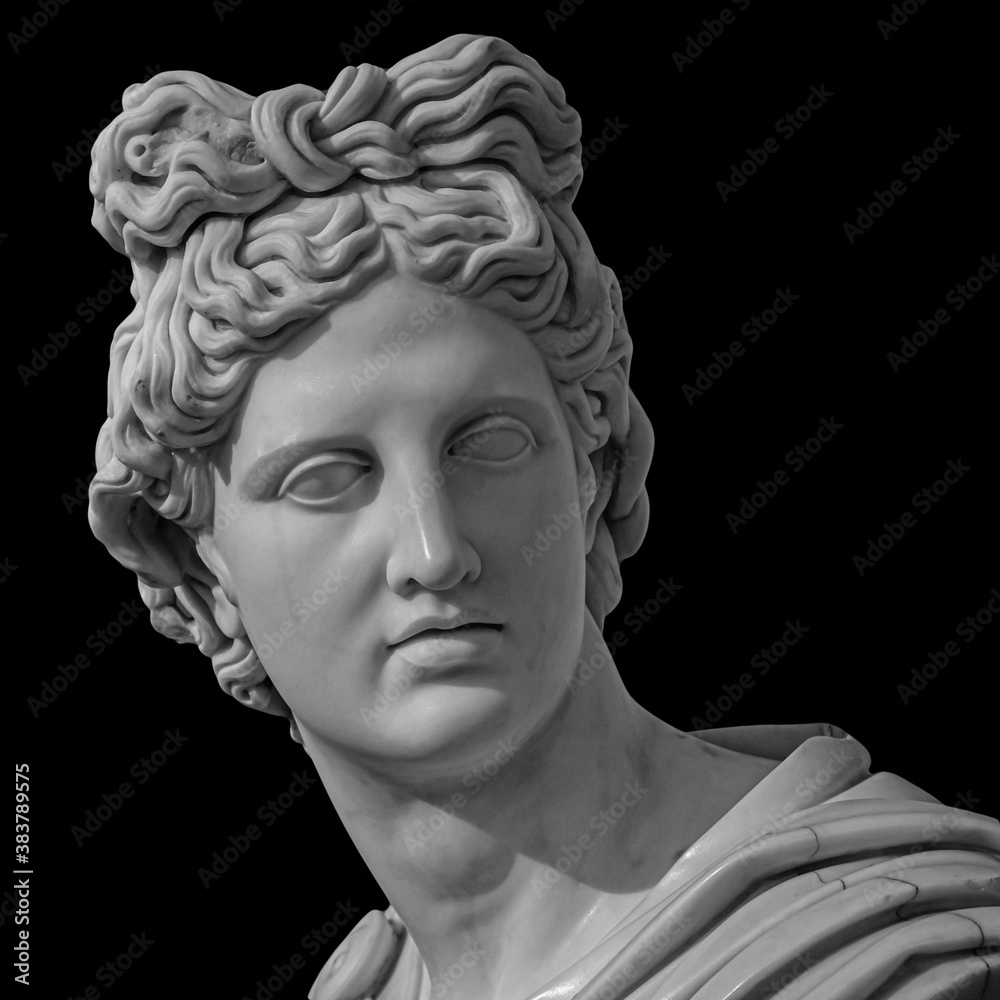 Portrait of a plaster statue of Apollo isolated on black