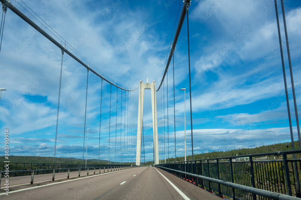 The High Coast Bridge in Sweden. It is a suspension bridge over the Angerman river between Kramfors and Harnosand municipalities in Adalen. The High Coast Bridge in Sweden. It is a suspension bridge over the Angerman river between Kramfors and Harnosand municipalities in Adalen.