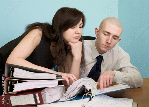 Bookkeeper and the secretary on a workplace photo