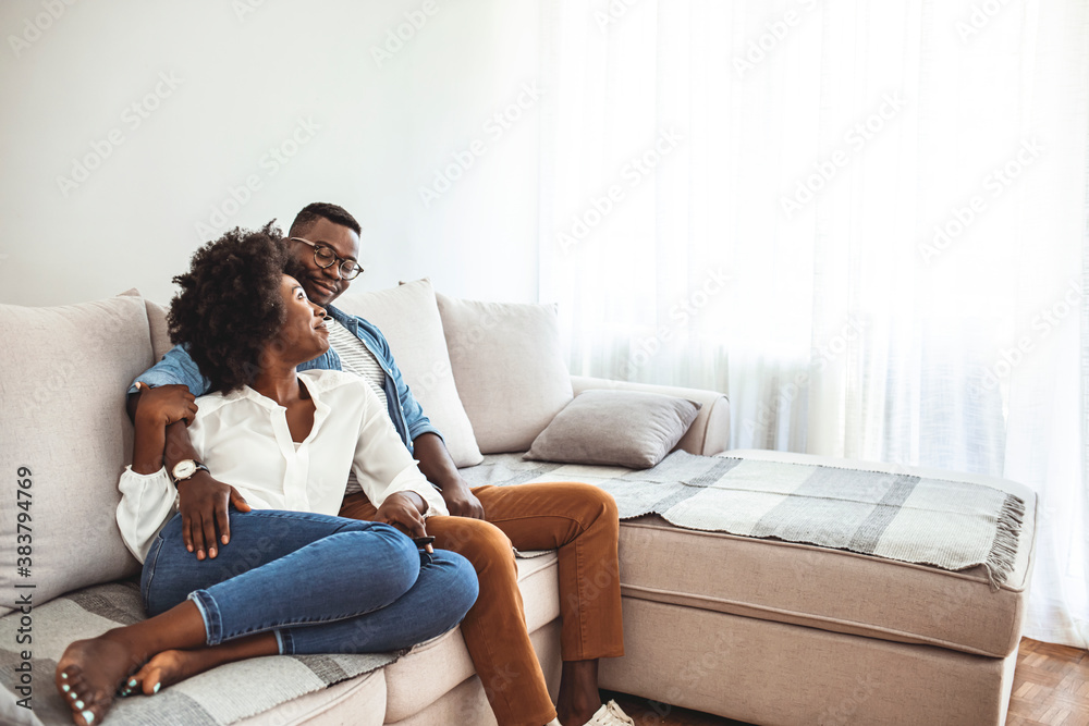 Couple relaxing on sofa. Young couple relaxing having nap or breathing fresh air, relaxed man and woman enjoying rest on comfortable sofa in living room. Couple relaxing on sofa. Young couple relaxing having nap or breathing fresh air, relaxed man and woman enjoying rest on comfortable sofa in living room.