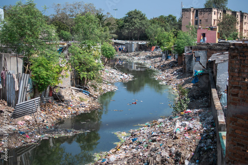 Plastic waste disposal in a river in the slums of Chennai, Tamil Nadu, India