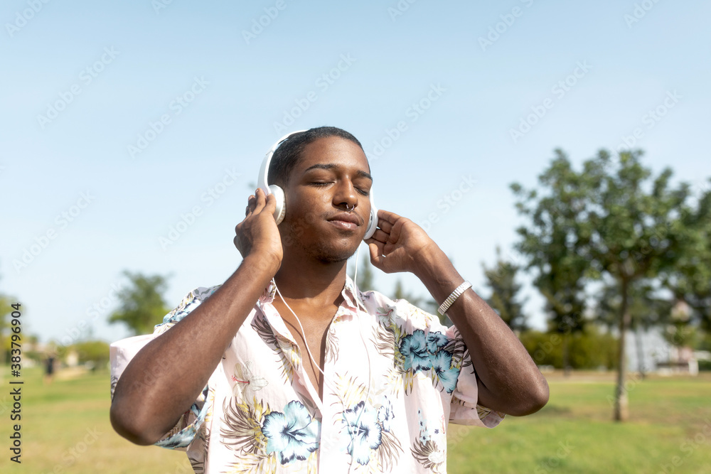 black man sightseeing around town with mobile and music helmets black man sightseeing around town with mobile and music helmets