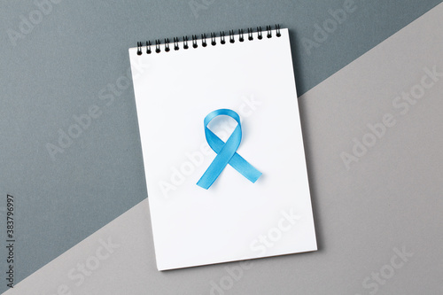 blue ribbon on open notebook photo