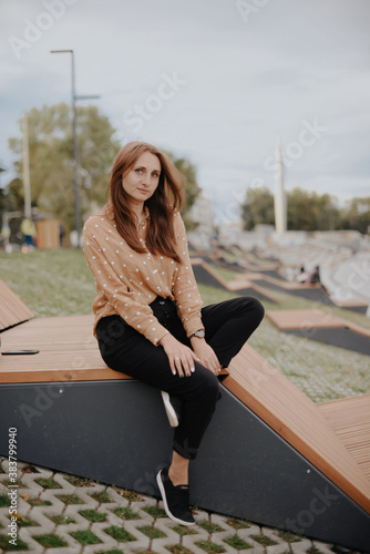 Portrait of a beautiful young woman with natural light outdoors in the city