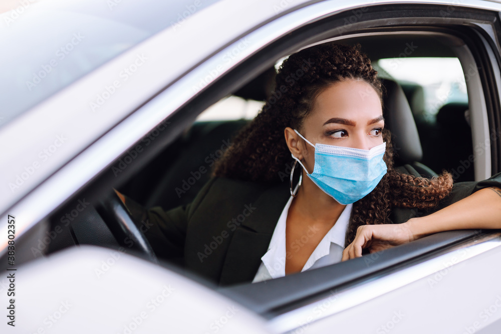 Young waiter in protective face mask and gloves while bringing food to a customer in cafe during coronavirus epidemic. Covid- 2019. Young waiter in protective face mask and gloves while bringing food to a customer in cafe during coronavirus epidemic. Covid- 2019.