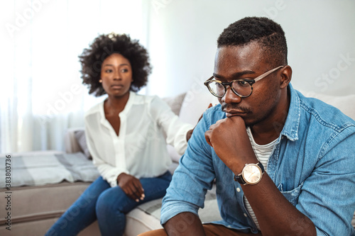  Break up, divorce and misunderstanding in relations concept. Upset couple at home. I can't believe we're fighting about this again. Unhappy Couple After an Argument in the Living Room at Home.