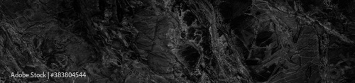 Black and white abstract background. Black stone rock grunge background. Dark rock texture.