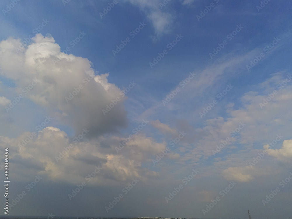 Beautiful white fluffy cloudy sky background,