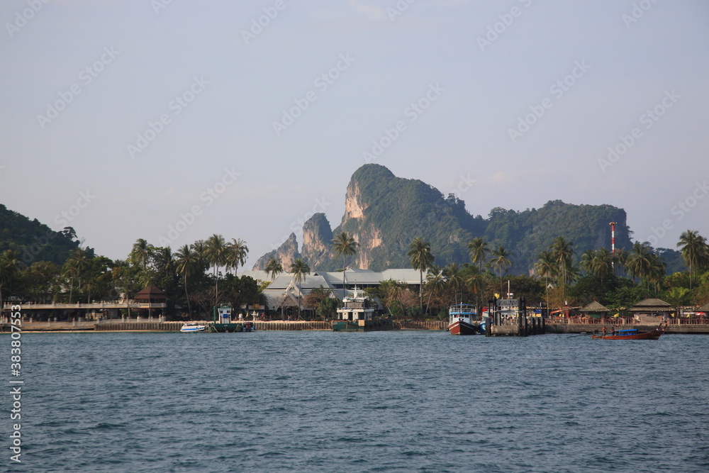 View of Phi Phi islands  main arrival port Tonsai bay with pier view and ferry boats in Phuket, Krabi province, Thailand 