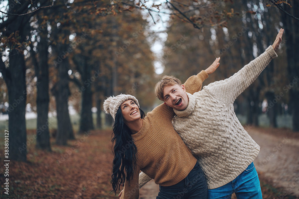 Lovely couple having fun together in nature. Fashion couple enjoying autumn. Emotion. Life. Love concept. 