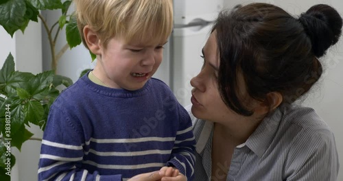 Child Cries Mother Calms Comforting Soothing Consoling Crying Son. Hugs Kisses at Kitchen 4K