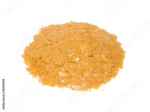 A handful of Carnauba wax on a white background