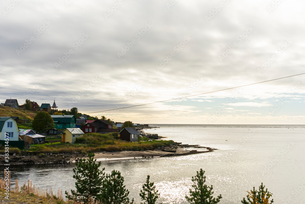 wooden old house on the river, far outside the city, Murmansk region in autumn, copyspace, landscape wooden old house on the river, far outside the city, Murmansk region in autumn, copyspace, landscape