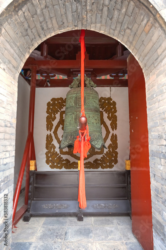 A bell inside a bell tower at Tianhou Palace - a famous Taoist temple in Tianjin, China photo