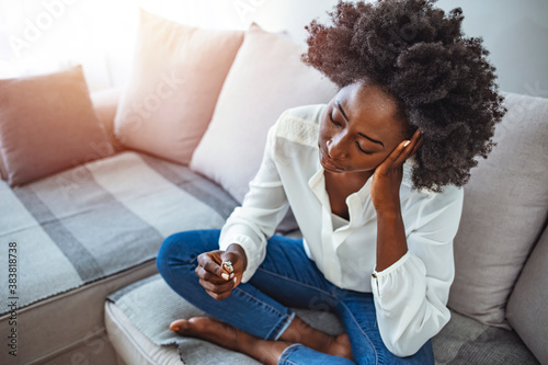 Close up of decisive woman take off wedding ring make decision breaking up with husband, young female remove engagement jewelry having relationships problems filing for divorce or annulment