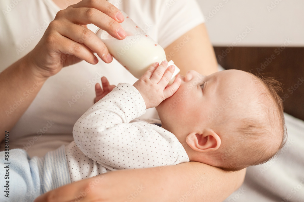 baby eats milk from a bottle baby eats milk from a bottle