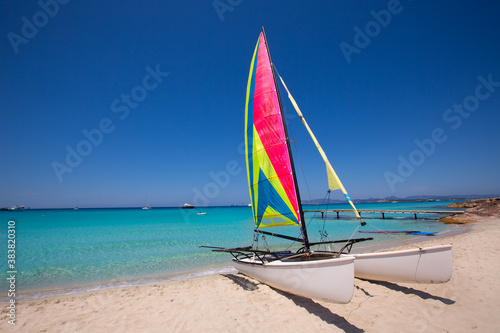 Catamaran sailboat in Illetes beach of Formentera photo
