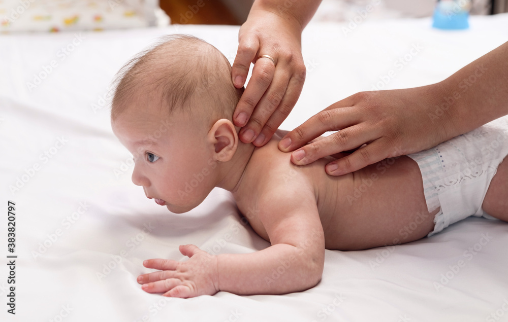 baby massage, close-up hands on baby back baby massage, close-up hands on baby back