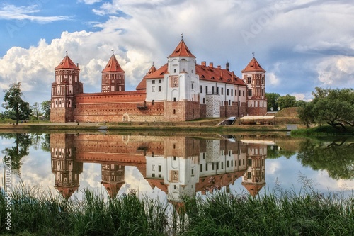 Castle with mirror reflection in the water of lake © Iryna